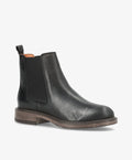 Sort læder Chelsea-støvle fra Shoedesign Copenhagen med elastiske sidepaneler og brun sål.