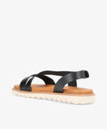Sort lædersandal fra Shoedesign Copenhagen med krydsremme og hvid sål.