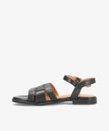 Sort lædersandal fra Shoedesign Copenhagen med flade såler og justerbar ankelrem.