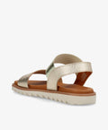Guld sandaler fra Shoedesign Copenhagen med krydsremme og hvid sål.