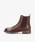 Brun læderstøvle fra Shoedesign Copenhagen med elastikpaneler og lav hæl.