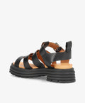 Sort lædersandal fra Shoedesign Copenhagen med tyk, rillet sål og justerbar rem.